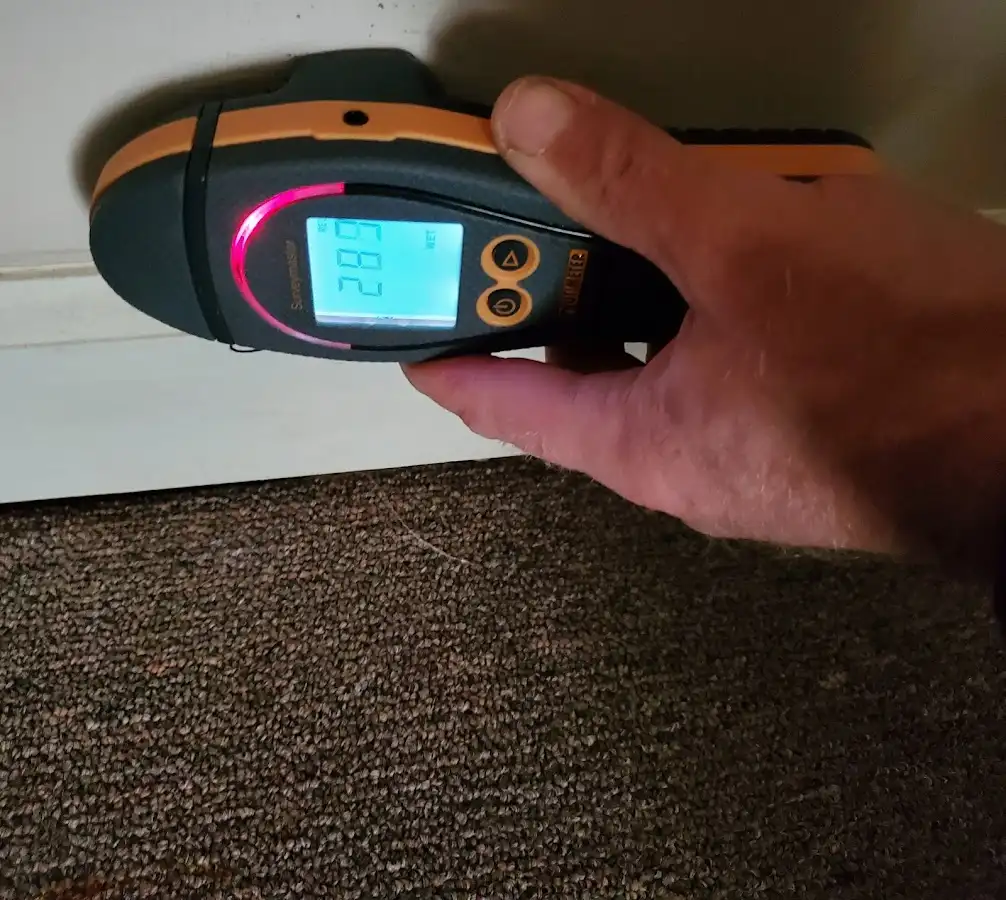 Moisture detection at baseboard during Sewage Cleanup & Sanitation in The Villages